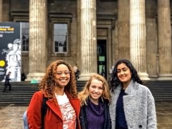 Students pose in front of museum steps in London