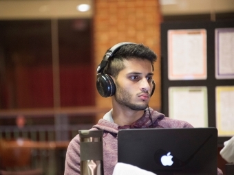 Student studies with his laptops