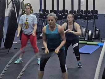 Employees Working out during a class at the Wildcat Wellness Gym