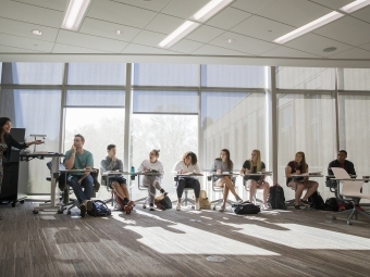 Row of students listen to professor