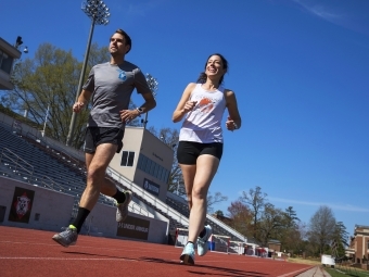 Two physics professors run on the track