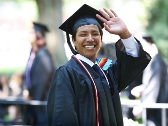 Student Waves at Camera