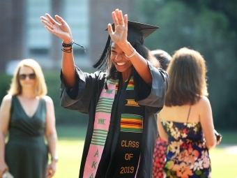 Student Waves at Camera