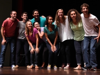 Health Advisers Group poses on stage