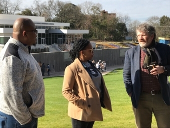 Kiara Boone '11, Hilton Kelly and Scott Denham talking outside