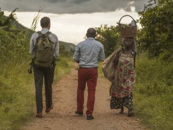 Ross Boyce with people from Uganda walking to water