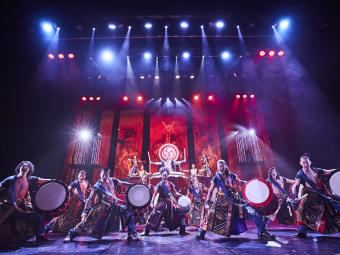 Yamato Drummers on stage with bright lights