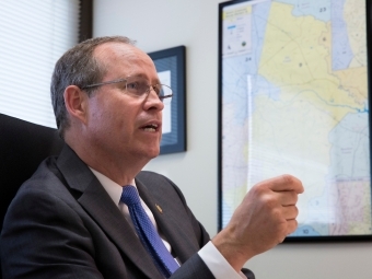 Rep. Greg Murphy speaking in a chair