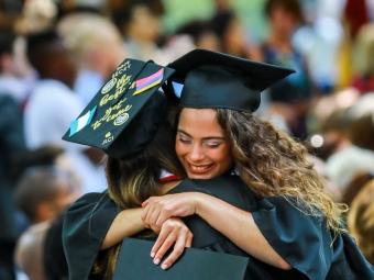 Friends Hug at Graduation