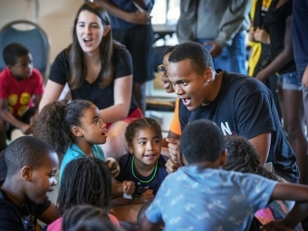 Students lead singing with kids from Freedom Schools