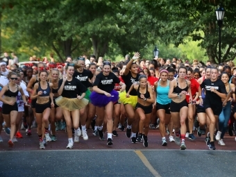 Students racing in costumes