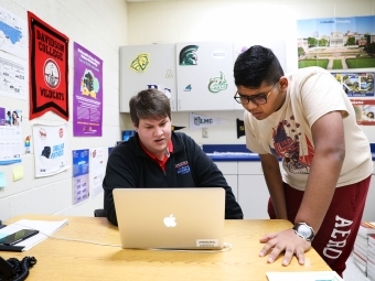 Thomas Hall meets with student