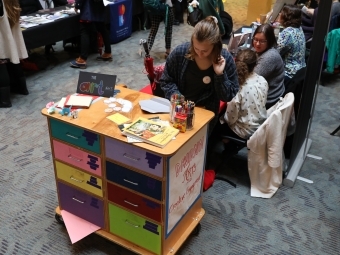 Student coloring at the Art Cart