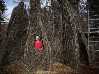 Patrick Dougherty Sculpture with artist