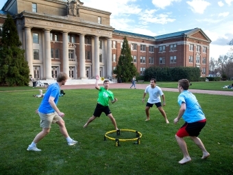 Playing ball outside Chambers - Warm February Weather Brings Students Out