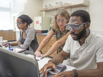 Prof. Hauser in Lab with Students