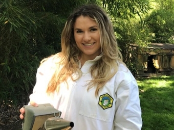 Katie Soden '21 tending to her bees