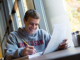 Student with Paper Studying