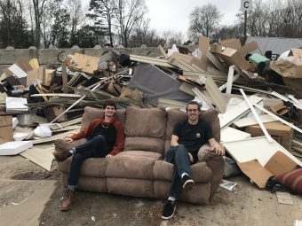 Mike Bauman and Jack Mathieson in a junk yard 