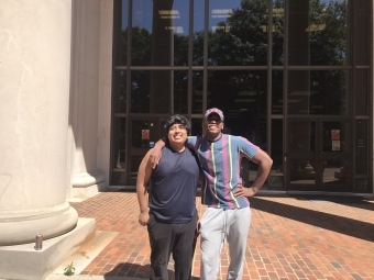 Jose Hernandez and Roy Toston in front of Davidson library 