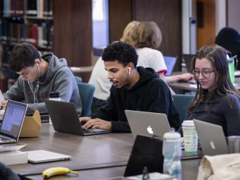 Students in Library on Laptops 