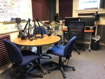 Podcast Studio room with tables, microphones and computers