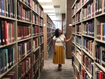 A bookworm in her new, soon to be library home