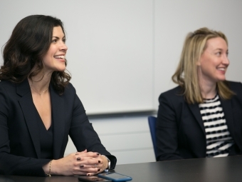 Jackie Kasulis ’98 smiling with another representative 