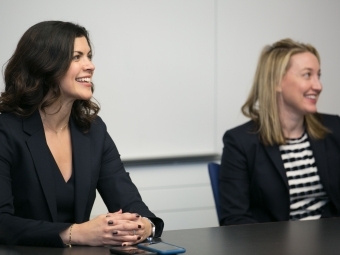 Jackie Kasulis ’98 smiling with another representative 