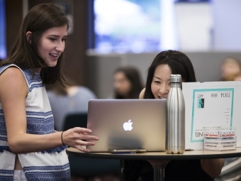 Student and Yurika Tamura Look at Laptop