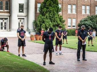 Social Justice Event - Football Team on the Green in front of Chambers