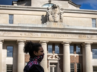 Social Justice Event - student in front of Chambers