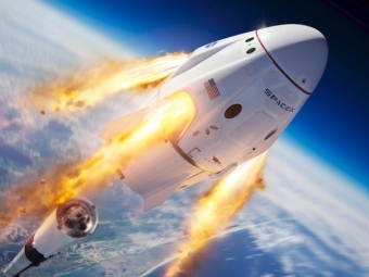Dragon space capsule over Earth