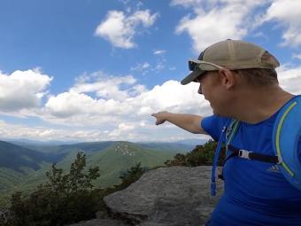Brad Johnson pointing to Linville Gorge