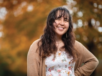 Mira Hartshorn '21 smiling with autumn background