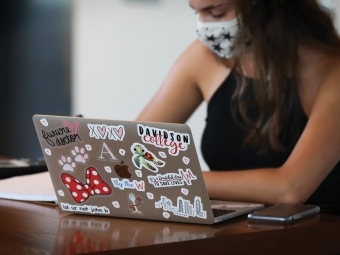 Student on Laptop Wearing Mask while Studying