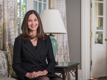Carol Quillen sitting on a chair