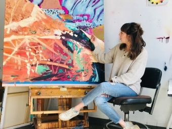 Adelle Patten with a painting