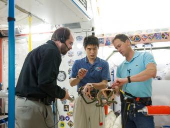 NASA astronaut Tom Marshburn (right) and Japan Aerospace Exploration Agency astronaut Takuya Onishi (center) participate in an emergency scenario training for space travel