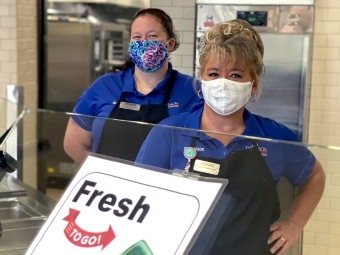 Two Commons Staff Members in Masks