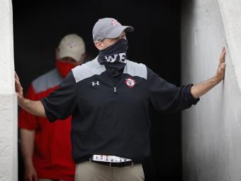 Coach Abel of Davidson Football Walking Out in a Mask that Says "We"