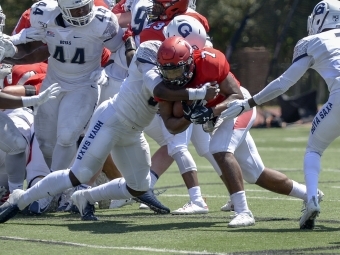 Jorell Story Mid-Tackle on Football Field