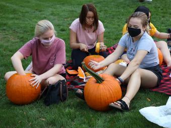 Pumpkin Carving with Masks on Campus