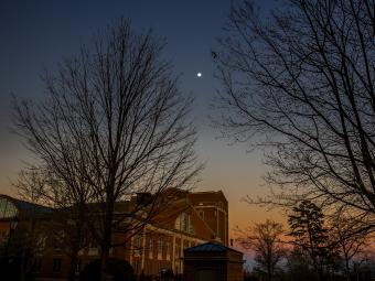 Sunset with Moon and Stars Over Campus
