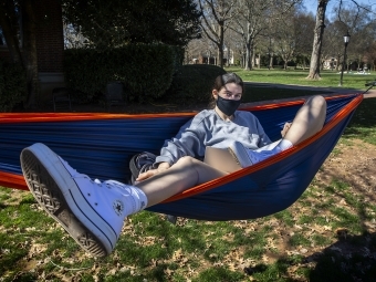 Student in Hammock Reading