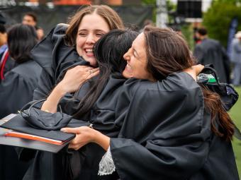 Students Hugging at Commencement 