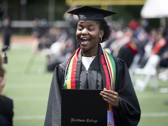 2021 Commencement Student Receives Diploma