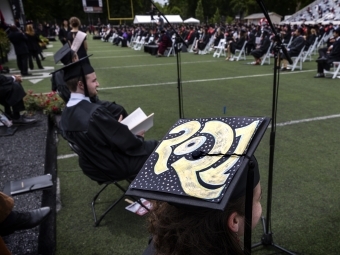 2021 Commencement Students at Graduation and with 2021 Cap