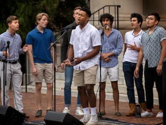students singing in front of Chambers lawn