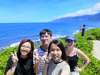 student with friends at oceanside on study abroad program 